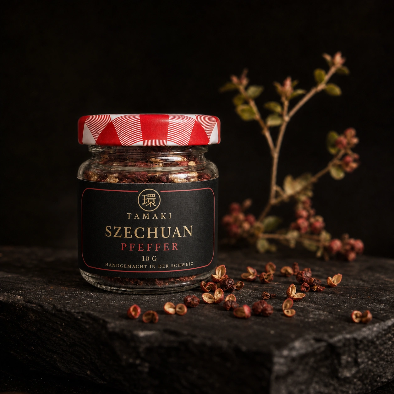 Szechuan pepper in a glass jar with red fruit husks