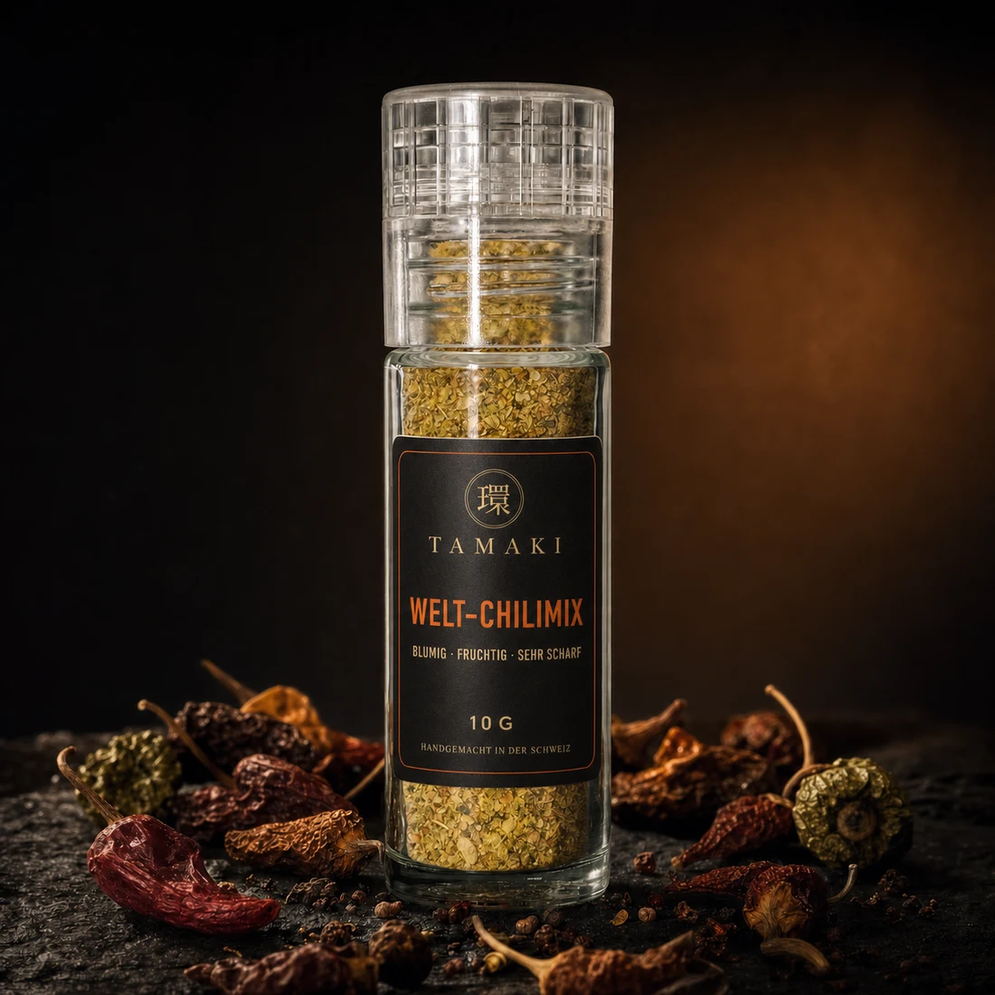 Tamaki World Chilli Mix in a glass grinder with dried chillies